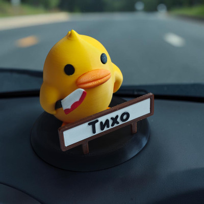 Декоративне каченя з ножем в авто, Тихо